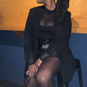 A black sheer mock neck H&M bodysuit